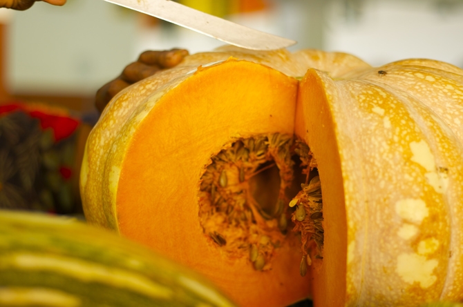 Pumpkin being cut at the market